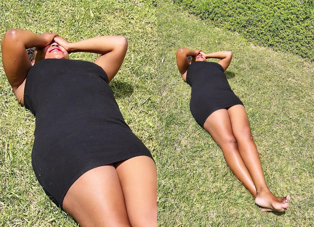 Betty Kyallo lying on grass